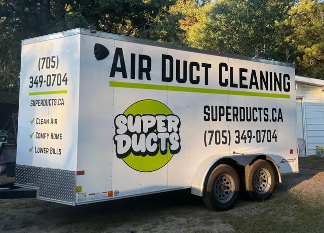 Super Ducts trailer parked under the pines in Novar, Ontario